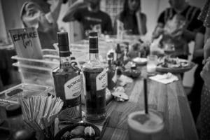 whiskey bottles sit on bar