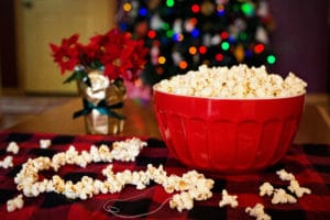 holiday stringing popcorn for christmas tree