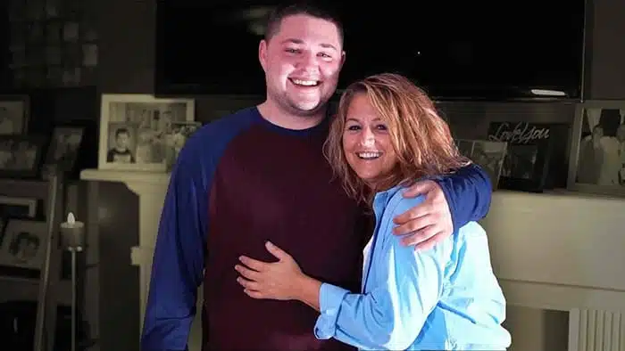 smiling son hugging smiling recovered mom from granite recovery centers