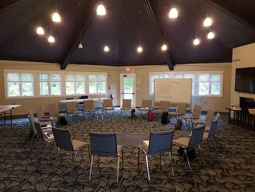 group room with chairs in circle with whiteboards at new freedom academy