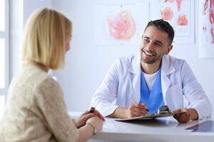 male doctor smiles at female patient in a xanax addiction rehab center
